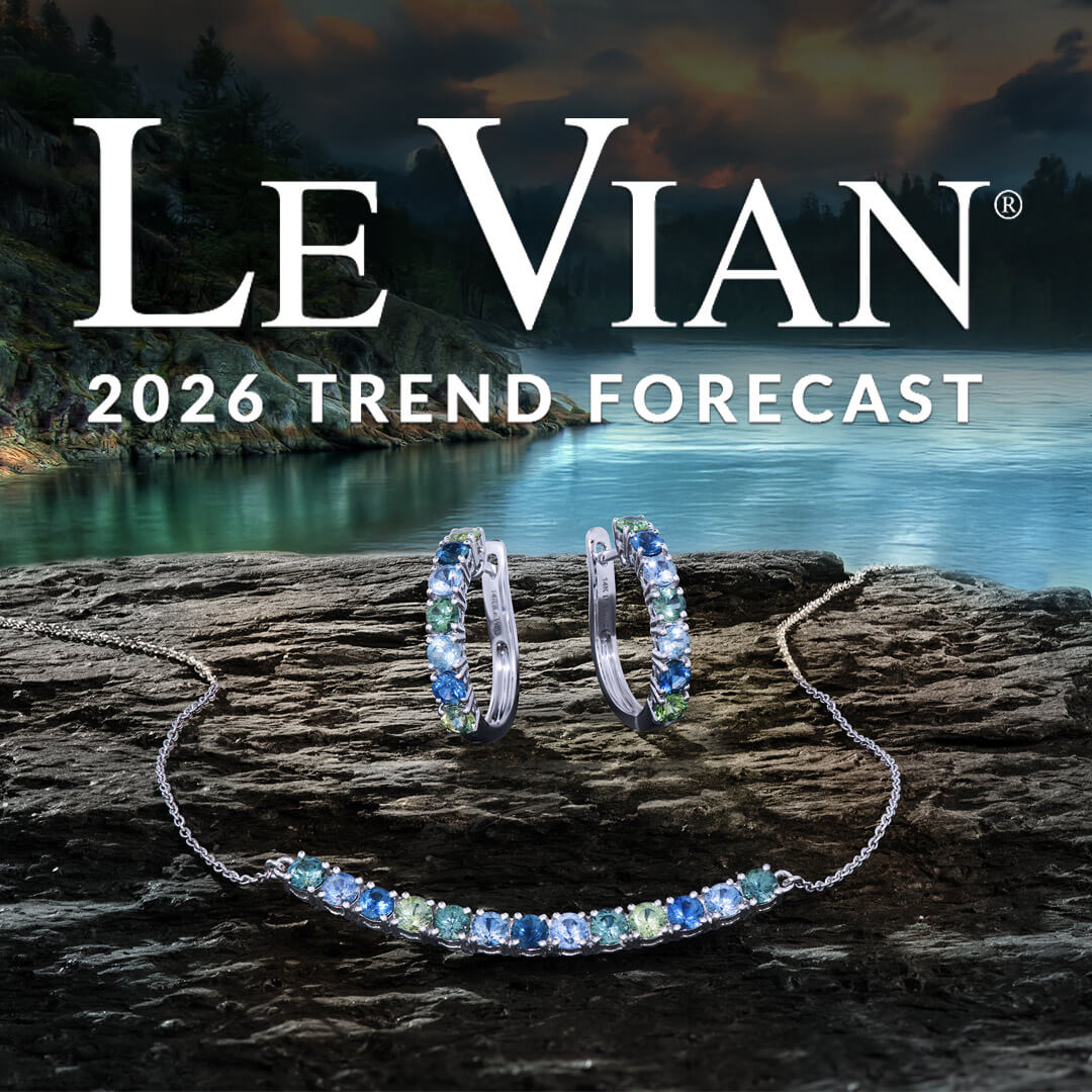 Le Vian Retailer 2026 Jewelry Trend Forecast Logo with Montana Sapphire Hoop Earrings and Montana Sapphire Smile Necklace on a Rock Next to a River in Montana