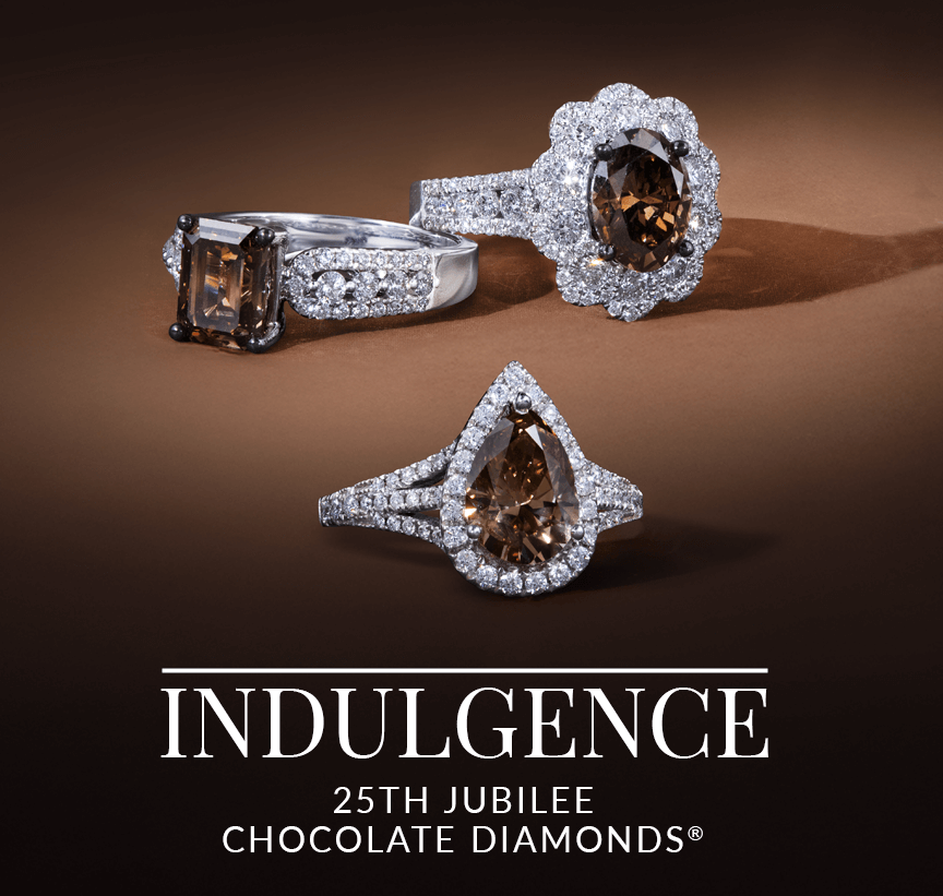 Celebratory Chocolate Diamond® rings with white diamond halos, set on a luxurious bronze background, marking Le Vian’s 25th Jubilee.
