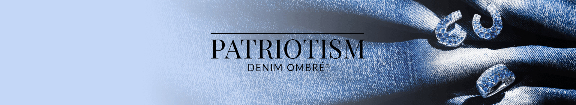 Blue ombré sapphire horseshoe and link motif earrings and ring resting on denim fabric, representing Le Vian’s Patriotism Denim Ombré® collection.