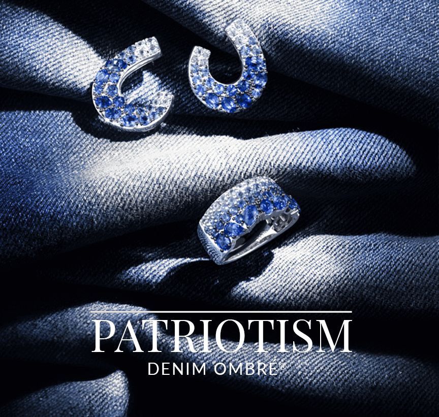 Blue ombré sapphire horseshoe and link motif earrings and ring resting on denim fabric, representing Le Vian’s Patriotism Denim Ombré® collection.
