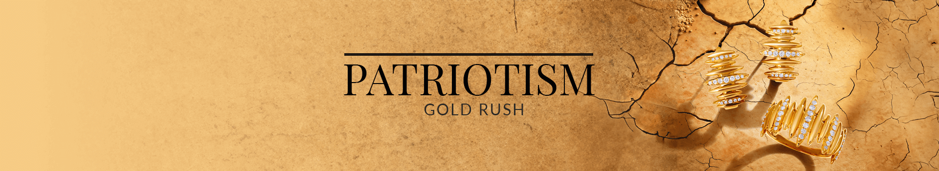 Bold gold and diamond jewelry with ridged and stacked textures laid on cracked earth, from Le Vian’s Patriotism Gold Rush collection.