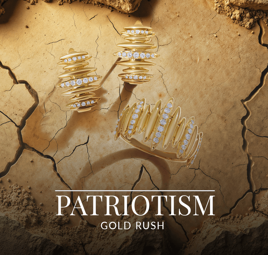 Bold gold and diamond jewelry with ridged and stacked textures laid on cracked earth, from Le Vian’s Patriotism Gold Rush collection.
