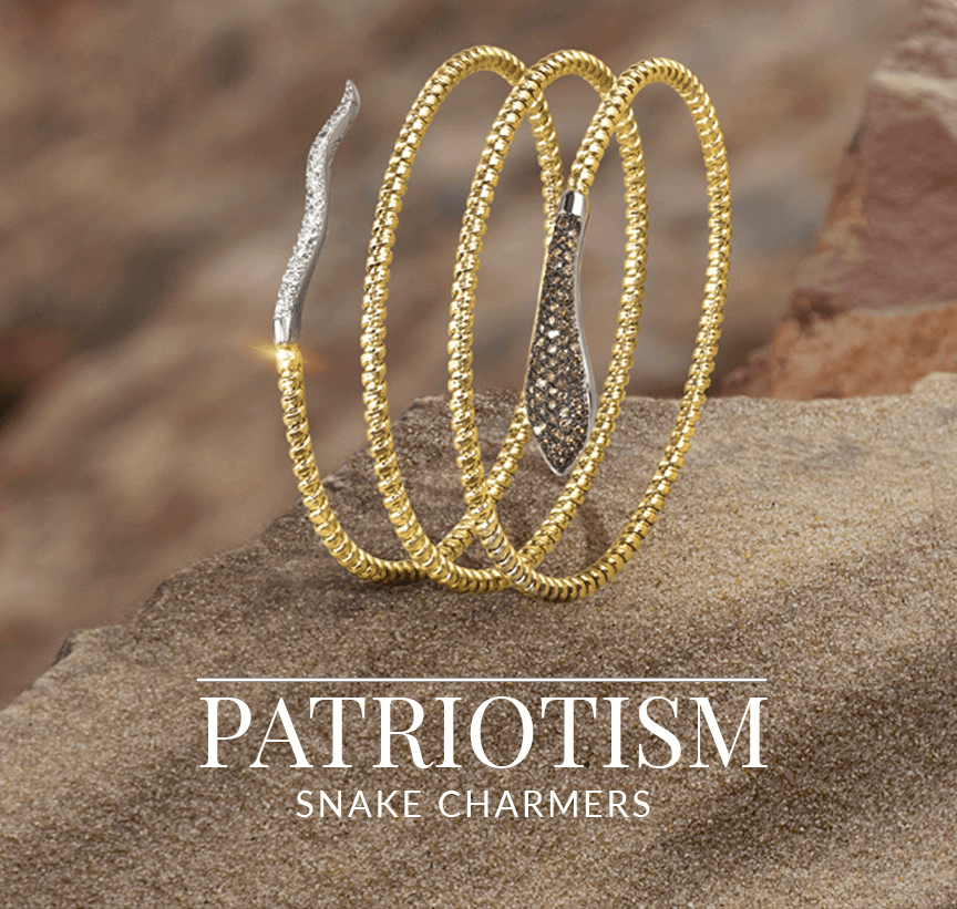 Gold wrap-around bracelet with snakehead and tail details, encrusted with diamonds, coiled on desert rock, from Le Vian’s Patriotism Snake Charmers collection.