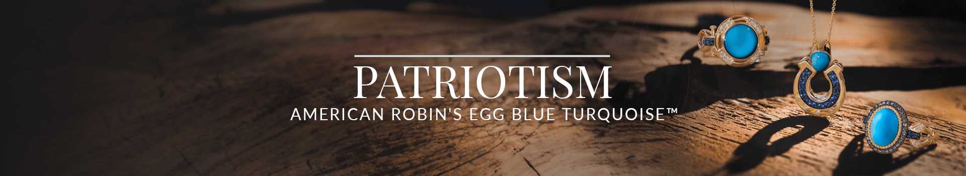 Jewelry featuring vibrant robin’s egg blue turquoise stones in gold and sapphire horseshoe settings, shown on rustic wood, from Le Vian’s Patriotism American Turquoise collection.