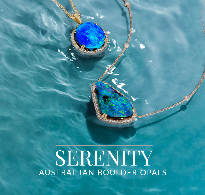 Close-up of a vibrant blue Australian boulder opal pendant set in gold with diamond accents, resting on shimmering water, from Le Vian’s Serenity collection.