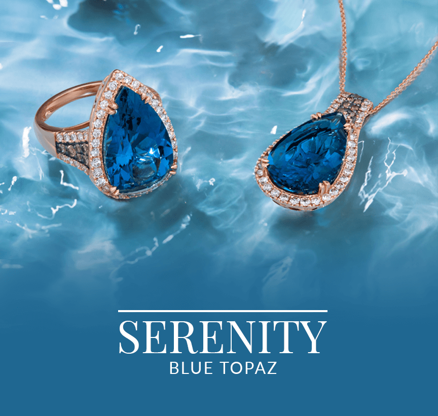 Elegant pear-cut blue topaz ring and pendant with diamond halos set against rippling blue water, from Le Vian’s Serenity Blue Topaz collection.