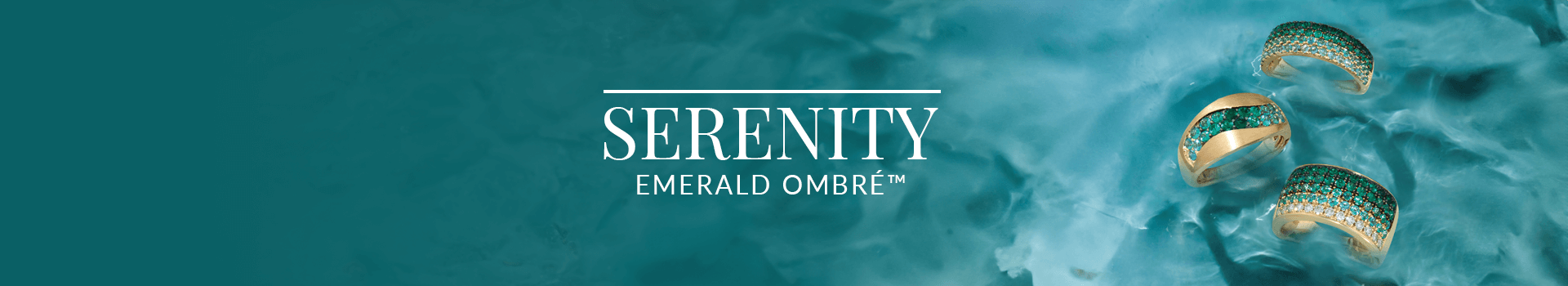 Three gold rings with vibrant green emerald ombré pavé detailing floating on serene water, from Le Vian’s Serenity Emerald Ombré™ collection.