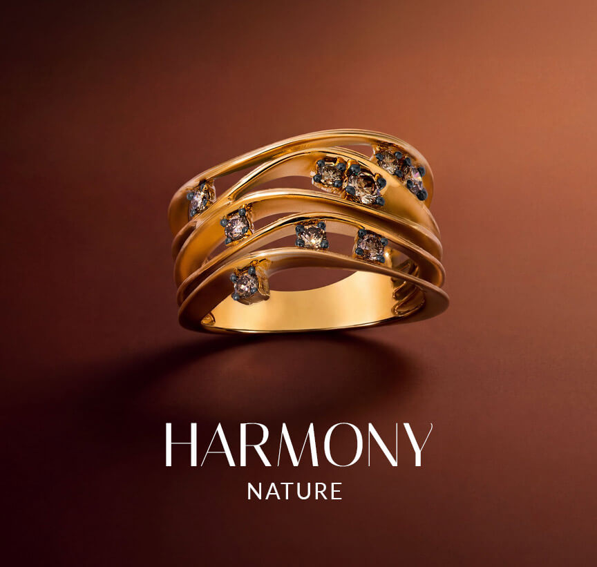 Gold Le Vian® ring with flowing layered bands and scattered diamond accents on a warm brown background.