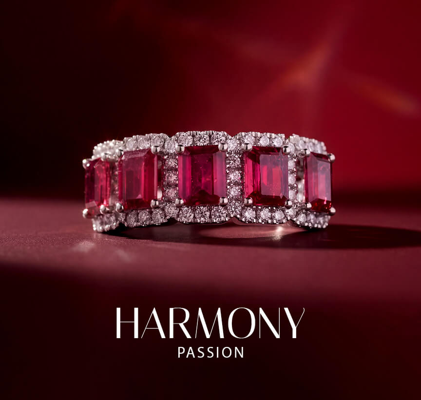 Le Vian® red gemstone ring with diamond accents on a dramatic red background.