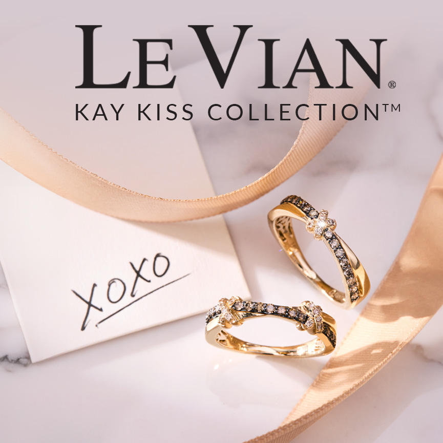 A Le Vian Kay Kiss Ring with Vanilla Diamonds, Chocolate Diamonds, and Yellow Gold, part of a jewelry collection.
